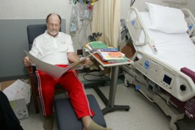 Gov. Corzine, calling himself "the most blessed person who ever lived," rests his broken leg as he reads get-well wishes at Camden's Cooper University Hospital. The photo was among the first since his crash.