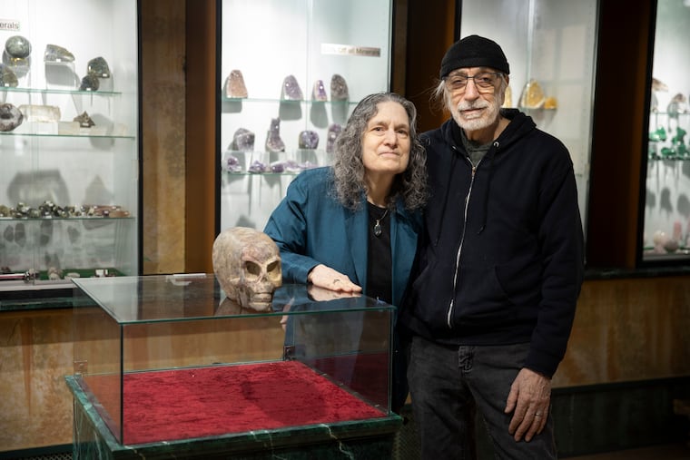 Owners Janice and Sal LaMarco in the back room of their South Street store, Mineralistic, with Sal's prized amethyst geode carved into the shape of an extraterrestrial’s skull.