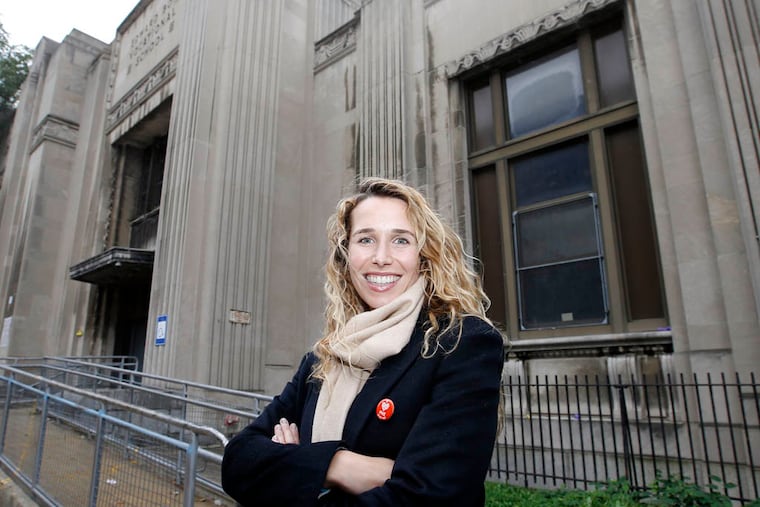 Lindsey Scannapieco, managing partner and principal of Scout Ltd., stands in front of Edward Bok Vocational High School in South Philadelphia on Monday, October 13, 2014. Scout Ltd. recently won a competition to transform the vacant Bok High School in South Philadelphia into a center for design, entrepreneurship and fabrication. ( YONG KIM / Staff Photographer )