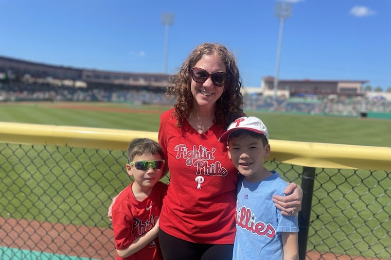 Inquirer reporter Kristen A. Graham with her sons, Julian, 7, and Kieran Goh, 9, at BayCare Ballpark in Clearwater, Fla.