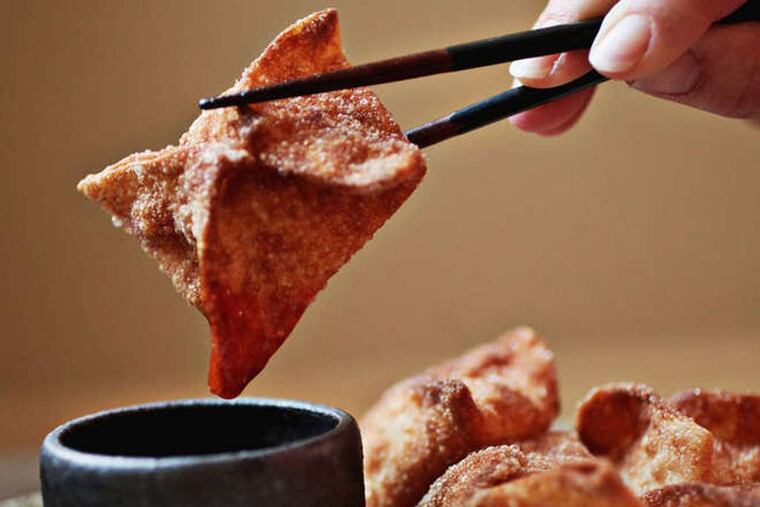 These Crab Rangoons are served with a sweet and sour sauce or plum sauce. (Juli Leonard/News & Observer/TNS)