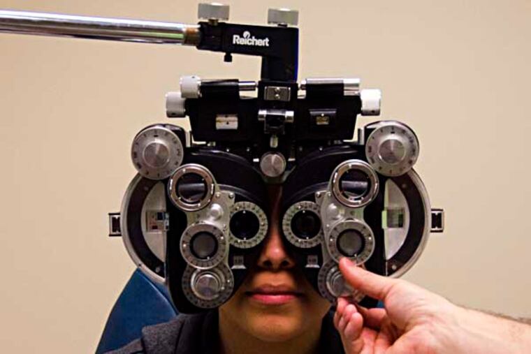 7th grader Ixel Jaqueline Chico-Pina receives an eye exam from a volunteer at the 5th annual Give Kids Sight Day at the Wills Eye Institute on April 12th. (RACHEL WISNIEWSKI / Staff Photographer)