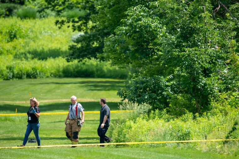 Fire and rescue personnel surround the scene where a small plane crashed in Buckingham.