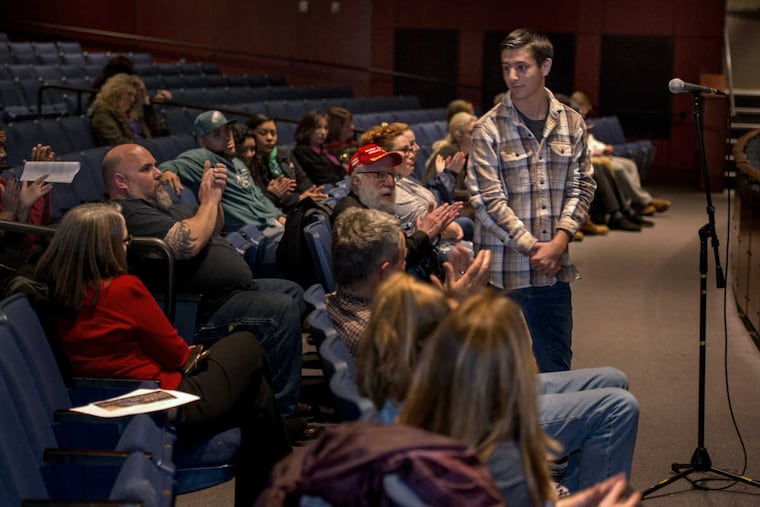 Cherry Hill High School East junior Evan Rothkoff, 16, is applauded as he completes his testimony before the Cherry Hill school board meeting March 6, 2018. He spoke in support of his AP World History teacher, Timothy Locke, who was suspended last month.