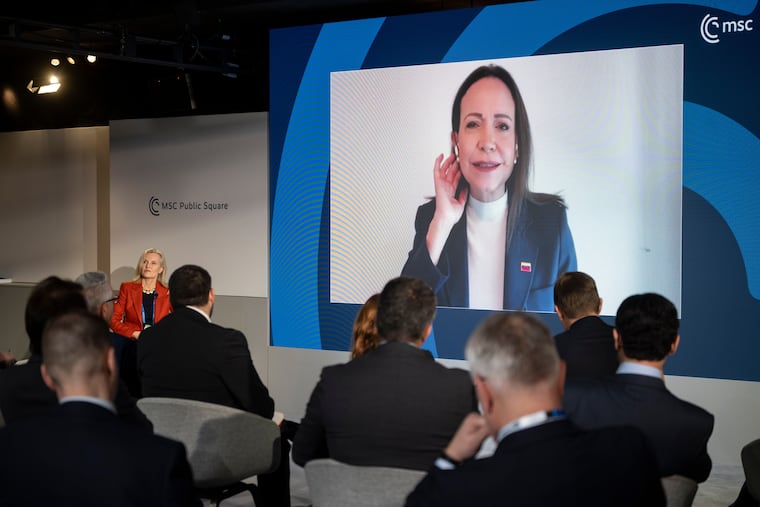 Venezuelan opposition politician María Corina Machado, on the screen, joins the Munich Security Conference in Munich, Germany, Saturday Feb. 14, 2026.