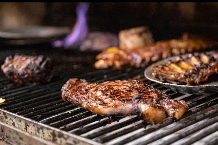Steaks cook on the grill at The Pub restaurant on Friday, Sept. 20, 2024 in Pennsauken, N.J. The Pub reopened today after renovations.