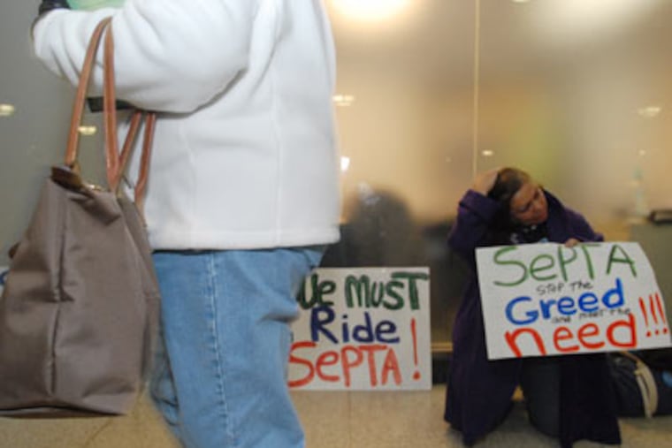 Tila Ayala of Philadelphia makes an emotional statement about the strike by SEPTA workers at Suburban Station on Friday evening. Rush hour lines for Regional Rail trains were long but civil. (Bob Williams / For The Inquirer)