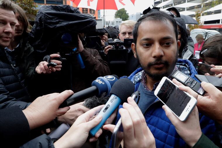 Tofazzal Alam, a survivor of the Linwood Mosque shootings, speaks to the media outside the High Court in Christchurch, New Zealand, Friday, April 5, 2019.
