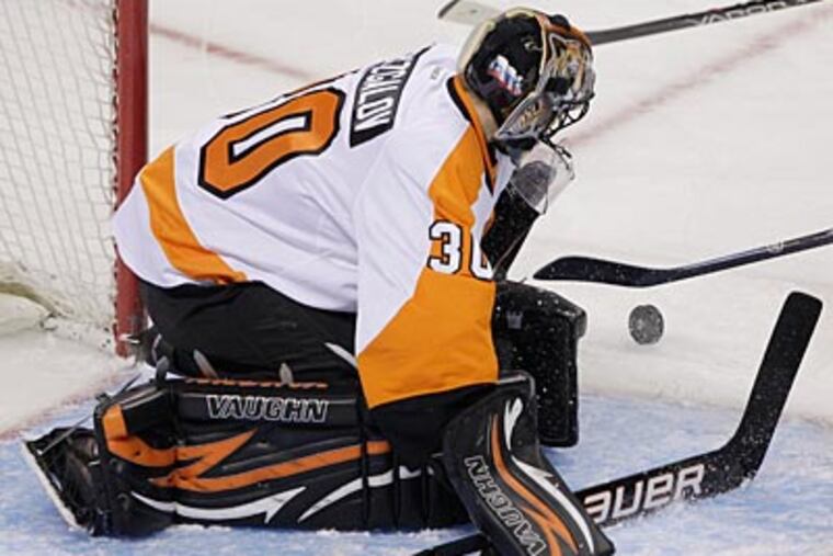 "He looks very much in charge of his net right now," Peter Laviolette said about Ilya Bryzgalov. (Paul Sakuma/AP)