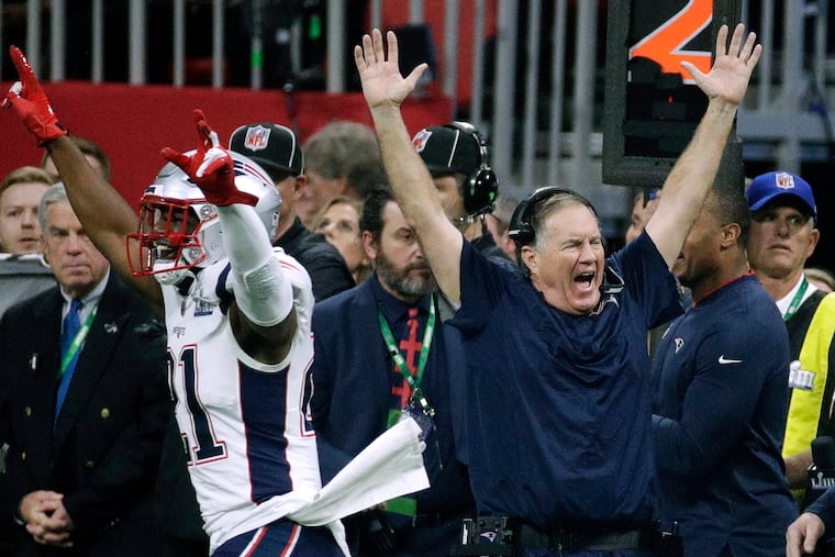 In this Feb. 3, 2019, file photo, New England Patriots' Duron Harmon (21) and head coach Bill Belichick celebrate after the NFL Super Bowl 53 football game against the Los Angeles Rams in Atlanta.