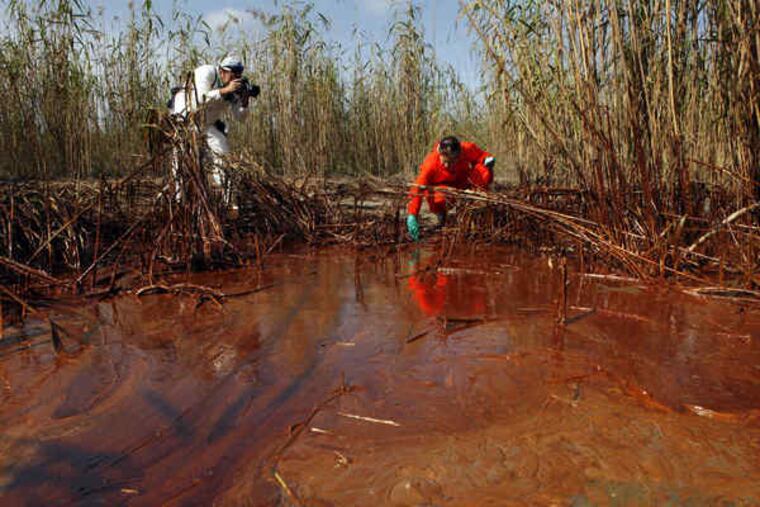 Anger has grown as oil has started washing into coastal wetlands in Louisiana. Lindsey Allen of Greenpeace took water samples Friday in Venice, La. A BP spokesman said that the company was putting equipment in place and completing tests.