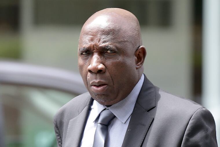 Tom Woewiyu outside the federal courthouse in Philadelphia during a break Monday from his immigration fraud trial.