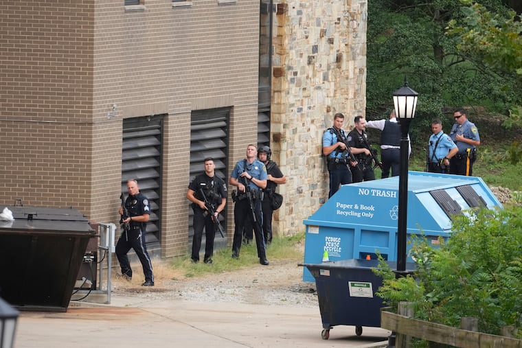 Police gather at the Villanova University campus where an active shooter was reported Thursday.