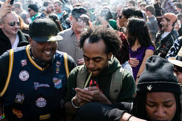 Hundreds of pot smokers gathered at Independence Mall outside of the Liberty Bell to celebrate the marijuana holiday, "420" and to protest agains drug laws in this recent file photo. A New Jersey bill to legalize pot was recently advanced to the floor for a vote. It includes provisions to erase past discriminatory marijuana possession records. (Colin Kerrigan / File photograph)