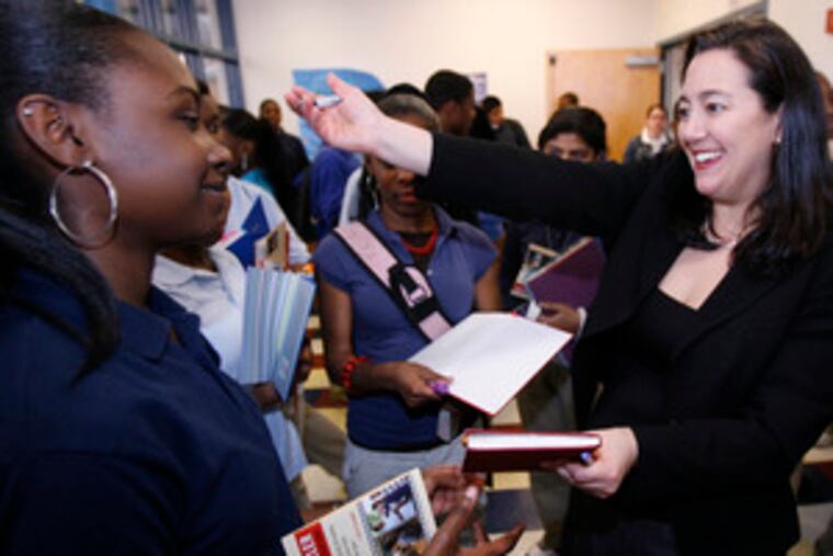 At Olney's Grover Washington Jr. Middle School, Erin Gruwell, the California teacher who inspired students to write about their lives, offers them a hug. The school isin the third year of a project inspired by Gruwell's "The Freedom Writers Diary."