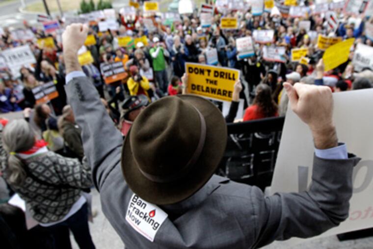 Eric Weltman, an organizer with Food and Water Watch, chants along with a crowd opposing natural gas drilling in the Delaware River watershed during a rally, Monday, Nov. 21, 2011 in Trenton, N.J. (AP Photo/Julio Cortez)