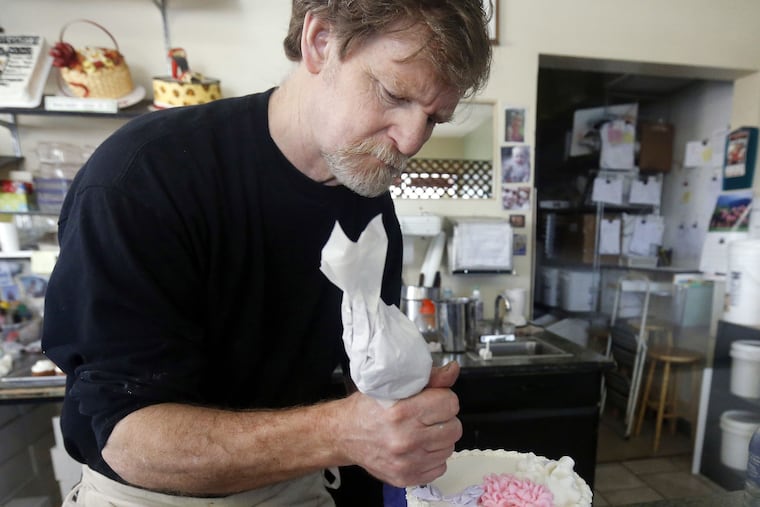 Masterpiece Cakeshop owner Jack Phillips decorates a cake inside his store in Lakewood, Colo., in 2014. He refused to make a wedding cake for a same-sex couple.