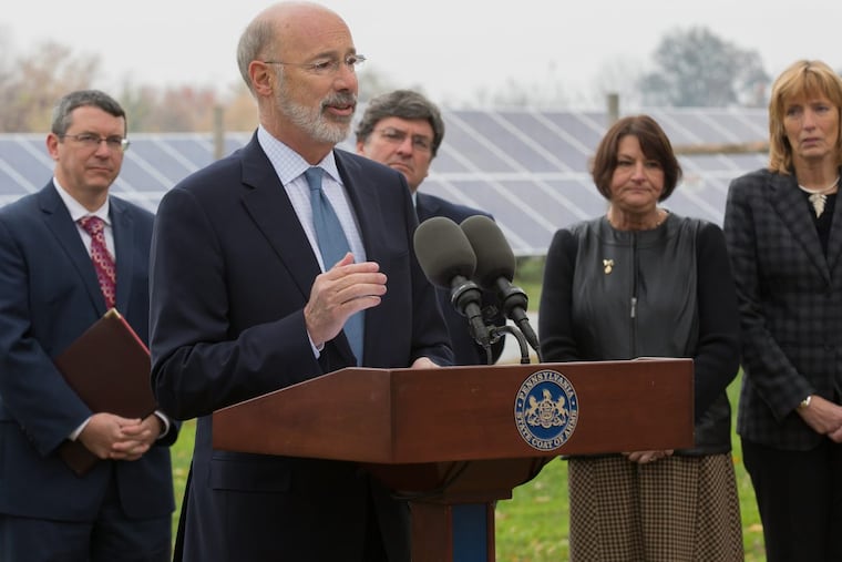 Gov. Wolf, surrounded by state officials, announces a new effort 11/13/2017 to boost solar energy in Pennsylvania at an event at a solar installationin Elizabethtown, Pa., that is owned and operated by Community Energy Solar. The state’s solar industry grew for the second year in a row.