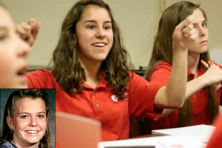 Samantha Fischer,11, Isabella Canuso, 17, and Ally Fischer, 14, brainstorm ideas for a 5K run and fund-raiser. The odd phrase "The Chicken Runs at Midnight" is inscribed on the tombstone of Amy Donnelly (inset). (Elizabeth Robertson / Staff)
