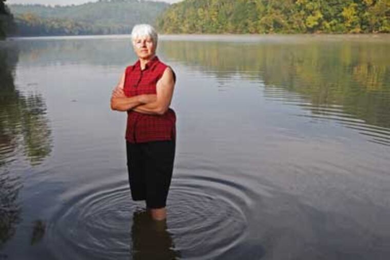 Sherry Neidichse, who bought a home about 1 mile form the Olin plant, is very upset with the mercury content of the air and water in the Hiwassee River. The Olin plant had been recognized as an environmental leader under a Bush administration program that the Obama administration now plans to end. (Michael Bryant / Staff Photographer)