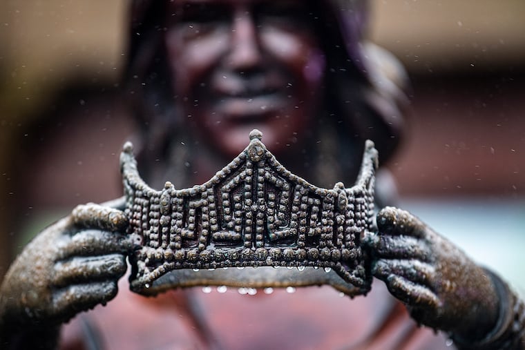 Raindrops formed on the crown of the Miss America Crowns You statue during a rainy winter day, Tuesday, Jan. 26, 2021, on the Atlantic City Boardwalk.