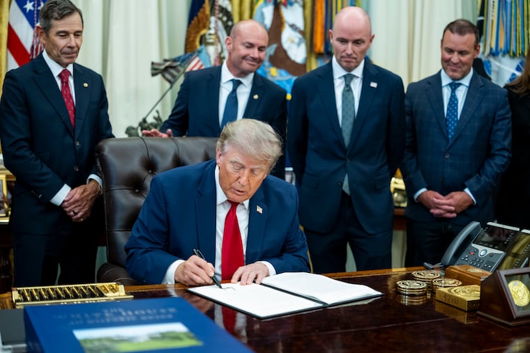 President Donald Trump signs an Executive Order during an event in the Oval Office of the White House in Washington, on Monday, July 13, 2026. Trump on Monday reduced the size of Bears Ears and Grand Staircase-Escalante National Monuments, teeing up a legal battle over whether presidents have the power to shrink such sites in the first place.
