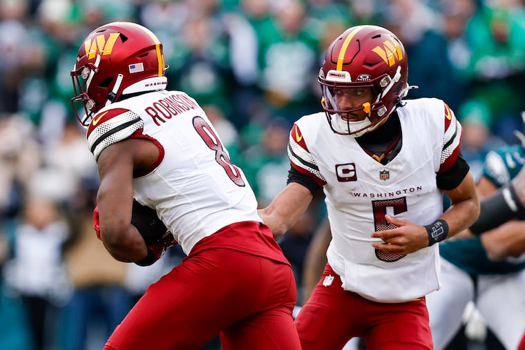 Washington Commanders quarterback Jayden Daniels hands off to running back Brian Robinson Jr. during during the NFC championship against the Eagles on Sunday, Jan. 26, 2025, at Lincoln Financial Field.