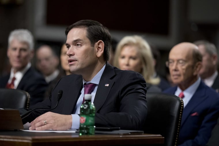 Sen. Marco Rubio, R-Fla., speaks in support to Commerce Secretary-designate Wilbur Ross, right, on Capitol Hill in Washington, Wednesday, Jan. 18, 2017, during Ross' confirmation hearing before the Senate Commerce Committee.