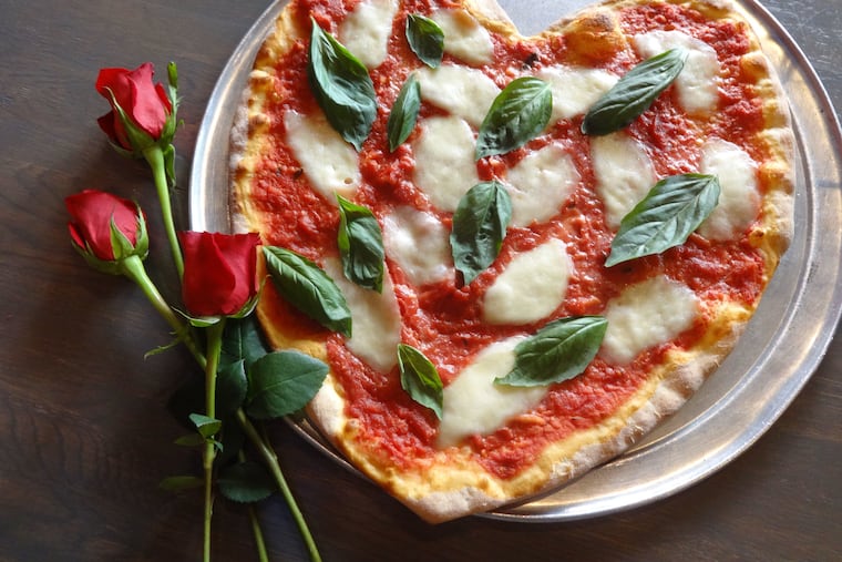 Forget vying for a reservation at a booked restaurant and call in an order for heart-shaped pizza instead.