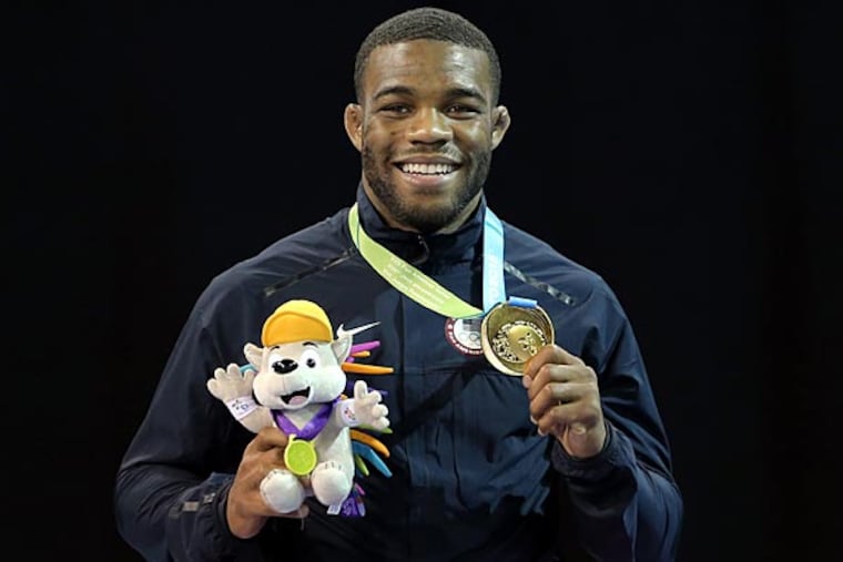 Jordan Burroughs of the United States celebrates winning the gold medal in the men's freestyle 74 kg finals during the 2015 Pan Am Games at Mississauga Sports Centre. (Matt Detrich/USA Today)