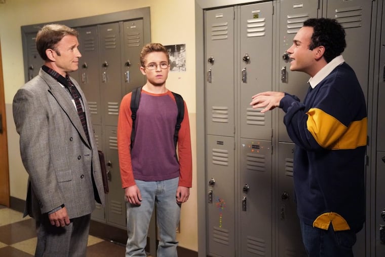 In the season premiere of ABC’s “The Goldbergs,” Ilan Mitchell-Smith (left), from the 1985 movie “Weird Science,” plays a teacher. Adam (Sean Giambrone, center), inspired by the movie, tries to create a new girlfriend for his brother Barry (Troy Gentile, right).
