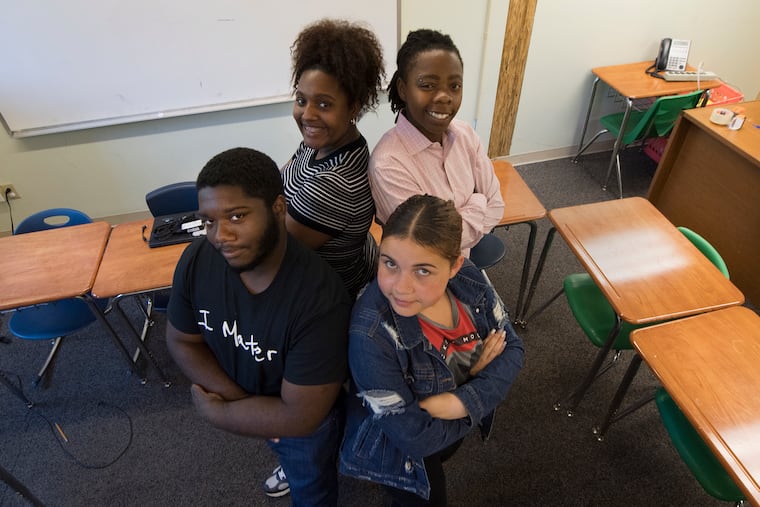 From left, going clockwise: Amun Jones-Bey, Bria Kelly, I-sha-le Watson and Siyanna Torres. who are in the foster-care system,say the staff at C.B. Community School have become like family to them.