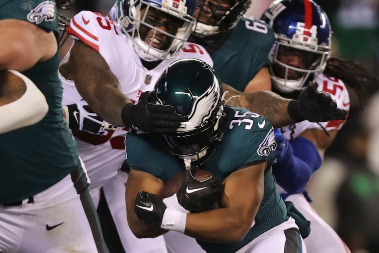 Philadelphia Eagles running back Boston Scott runs for a touchdown in the second quarter against the Giants at Lincoln Financial Field on Saturday, Jan. 21, 2023, in Philadelphia.