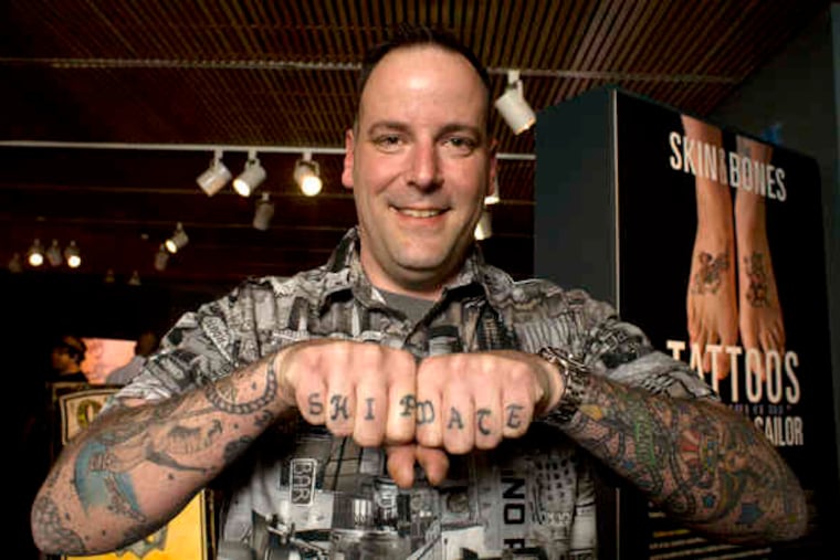 Coast Guardsman Richard Sambenedetto Jr. has tattoos decorating most of his body, including his feet, which bear a pig and a rooster. One striking image from the exhibit is "Captain Elvy," below, and his "full body suit" of tattoos, circa 1940.