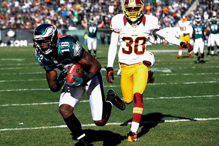 The Eagles' Jeremy Maclin, left, pulls in a touchdown pass
against the Redskins' D.J. Johnson. (AP Photo/Michael Perez)