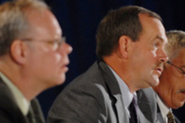 Joel Ario (center), at a hearing with Stephen Johnson, deputy insurance commissioner (left), and chief counsel Art McNulty.