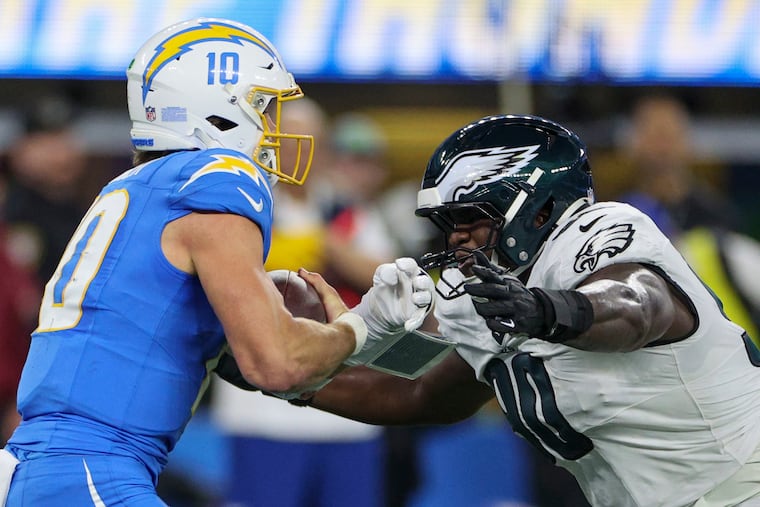 Jordan Davis prepares to sack Chargers quarterback Justin Herbert on Monday night.