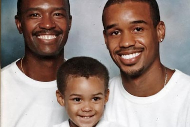 Former Temple star Lynn Greer (right) with his father, Lynn (left), and son, Lynn III. (File photo)