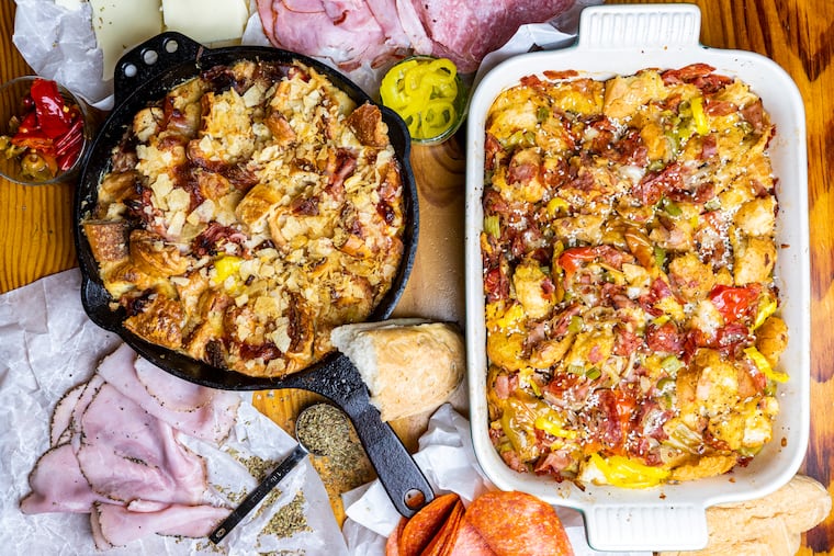 Hoagie stuffing, two ways. On the right, Rittenhouse-Style, made of layers of oregano-fried onions, banana peppers, Sarcones rolls, capicola, pepper ham, soppressata, and genoa salami. On the left, a torn-up Italian hoagie from Angelo's mixed with stock, eggs, and milk, and topped with Herr's light and tasty, both made by Inquirer Food Editor Margaret Eby in Philadelphia, Pa., on Thursday, Oct., 19, 2023.