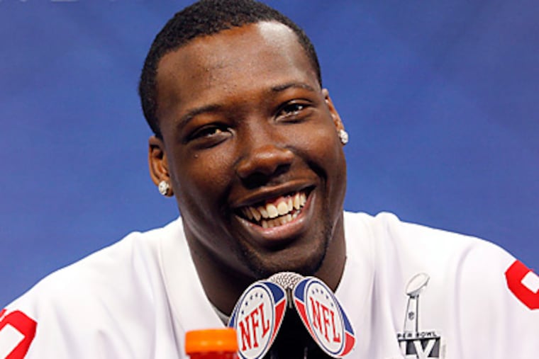Jason Pierre-Paul smiles during Media Day in Indianapolis. (AP Photo/Michael Conroy)