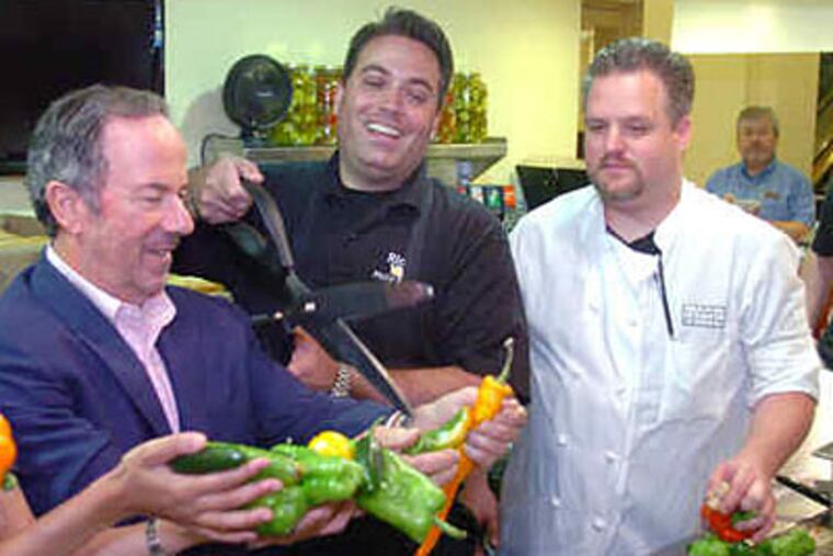 At the opening of Rick's Steaks at the Park Hyatt at the Bellevue are owner Rick Olivieri (center); George Rubin (left) of the firm that owns the hotel building; and Capital Grill chef Shawn Sollberger.