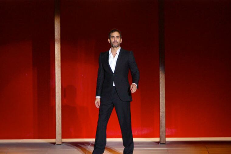 Marc Jacobs greets the crowd after showing his Spring 2013 collection during Fashion Week in New York, Monday, Sept. 10, 2012. (AP Photo/Seth Wenig)
