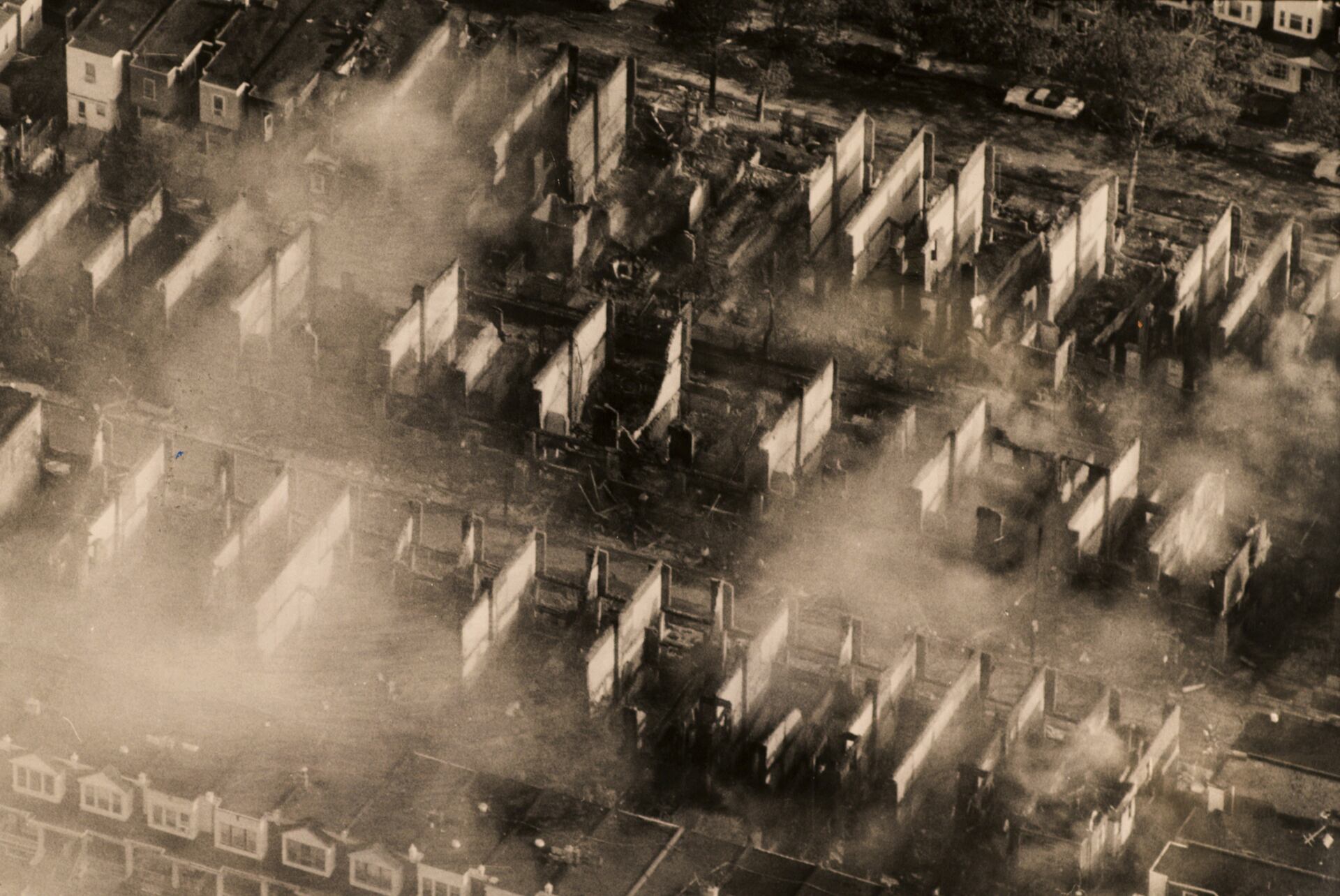 The day after the May 13, 1985, MOVE confrontation, an aerial view of Osage Avenue and Pine Street devastated by fire.