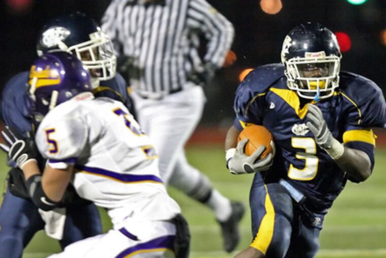 Maples is on the run during West Catholic's 37-14 playoff semifinal triumph against Lancaster Catholic.