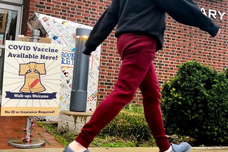 Signage at the Tacony Library on Torresdale Avenue. The CDC greenlighted boosters of all vaccines for certain high-risk groups and authorized "mix-and-matching" of vaccine types.