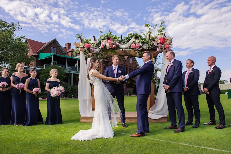 MGWED01- Bride Heather Schmidt and her groom Matt Osborne during their wedding ceremony on the cricket court 6/15/19 at the Merion Cricket Club. PHOTO By Rebecca Barger Photography