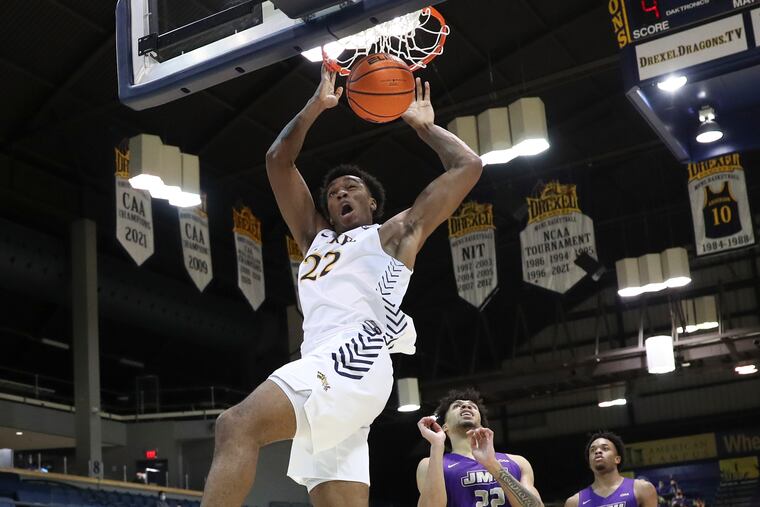 Drexel forward Amari Williams dunks the basketball past James Madison forward Julien Wooden during the second half Monday.