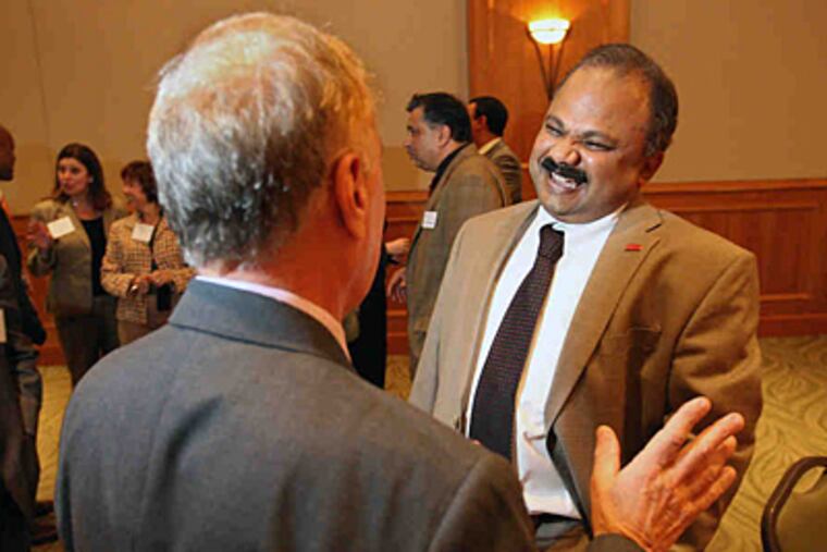 Dean Jaishankar Ganesh , at a faculty get-together. He currently is in India to talk education. "Business is global," he says. (Michael Bryant/Staff)