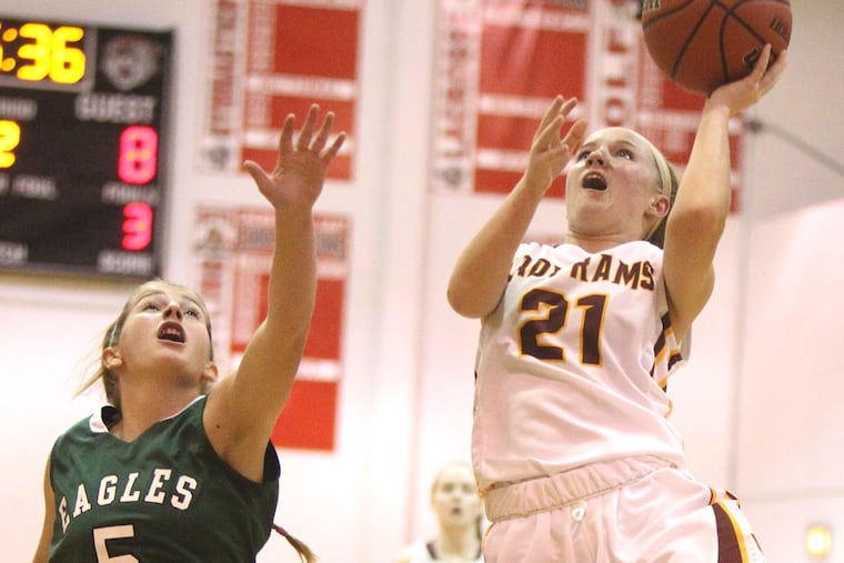 Maggie McIntyre, who scored 22 points, drives for a layup past West Deptford's Samantha Budd. CHARLES FOX / Staff Photographer
