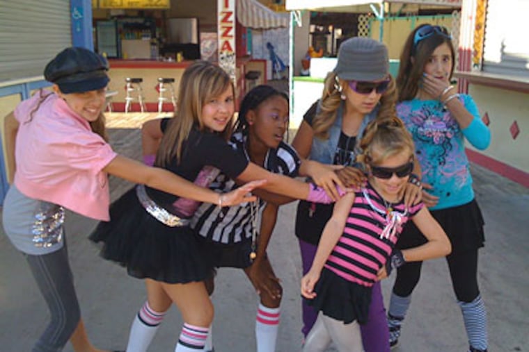 The Ovations, the group of middle-school "good girls" who vie against the "mean girl" Wiggies in a music-video competition.